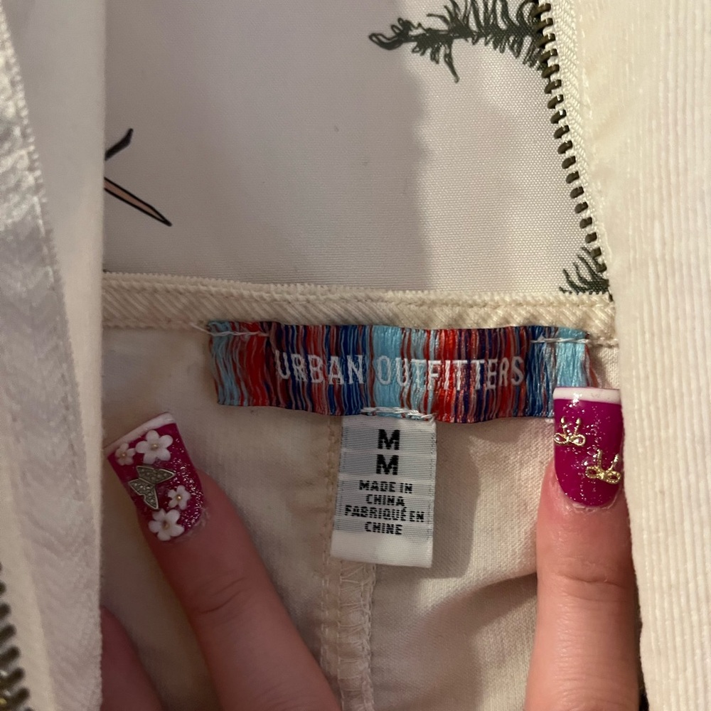 Halter shorts jumpsuit with star keychain zip up in the front. - Picture 6 of 7